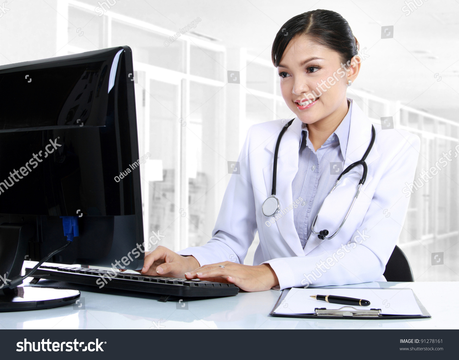 Woman doctor working on a computer